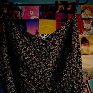 From Jeans Warehouse. Medium. It is blue with white, yellow and red flowers.